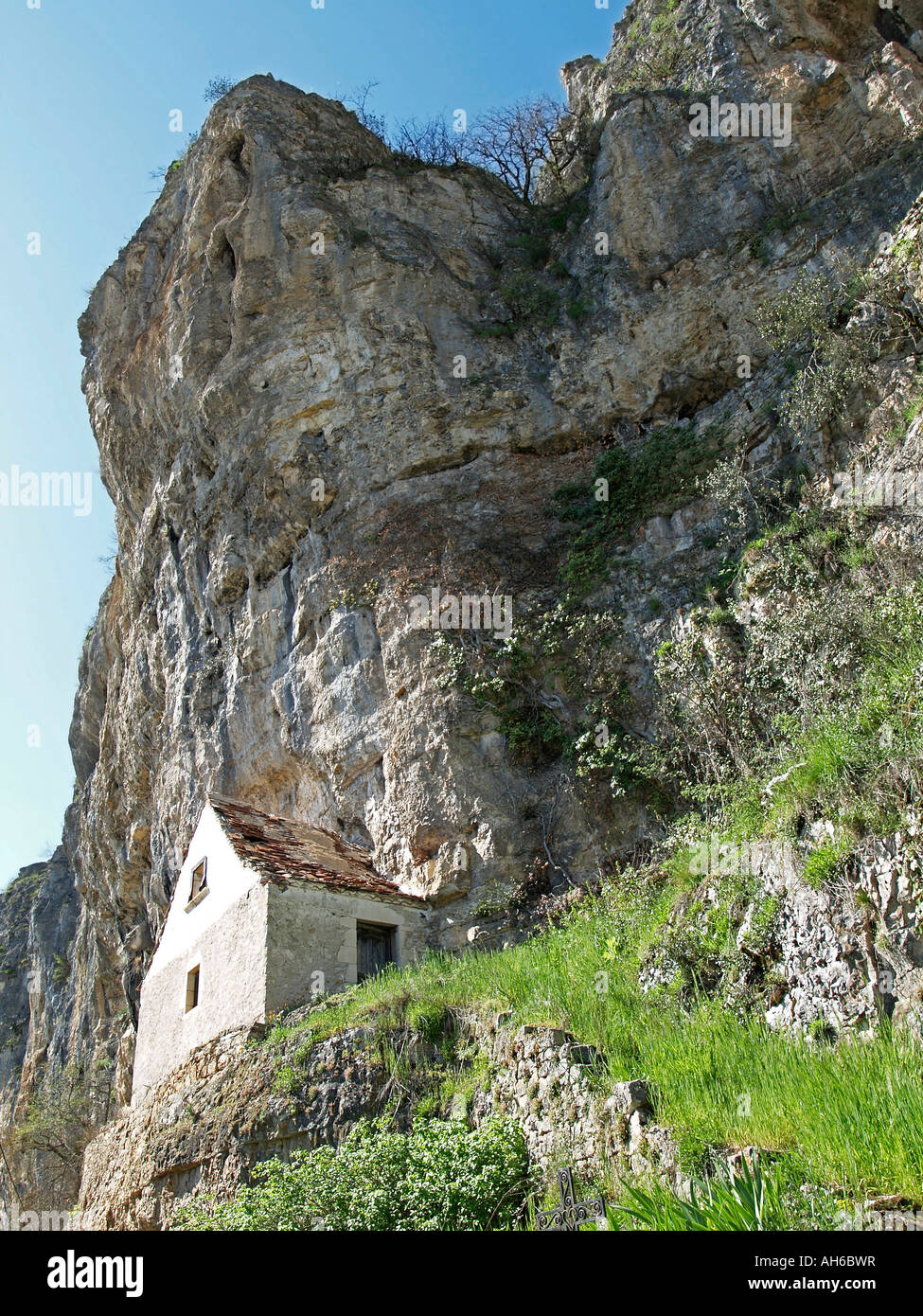 house built on walls of steep rocks in Gluges valley of Dordogne Lot