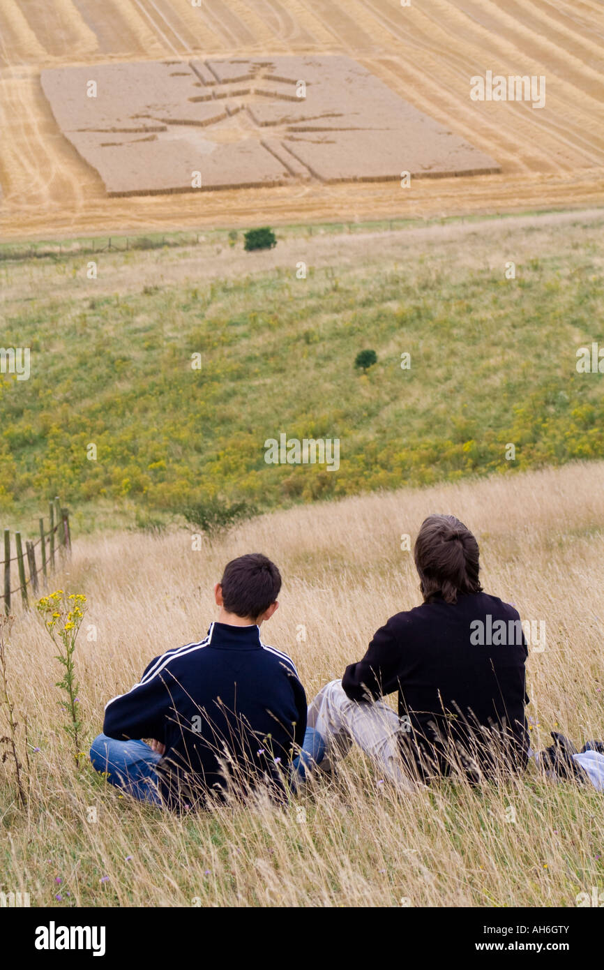 Father and son overlook crop circles Stock Photo