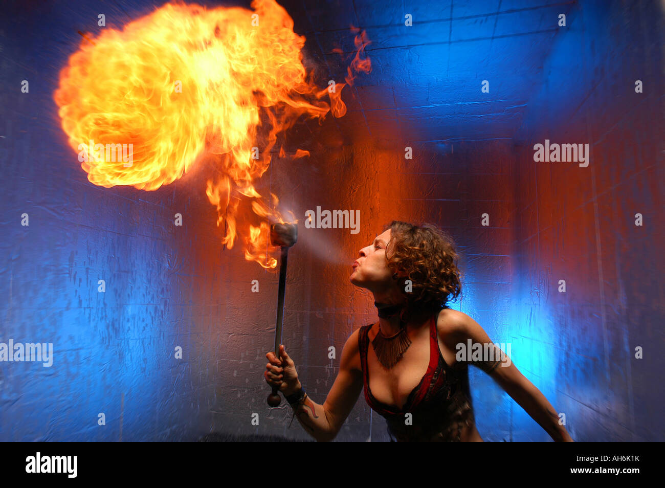 Fire Dancer spits fire Stock Photo