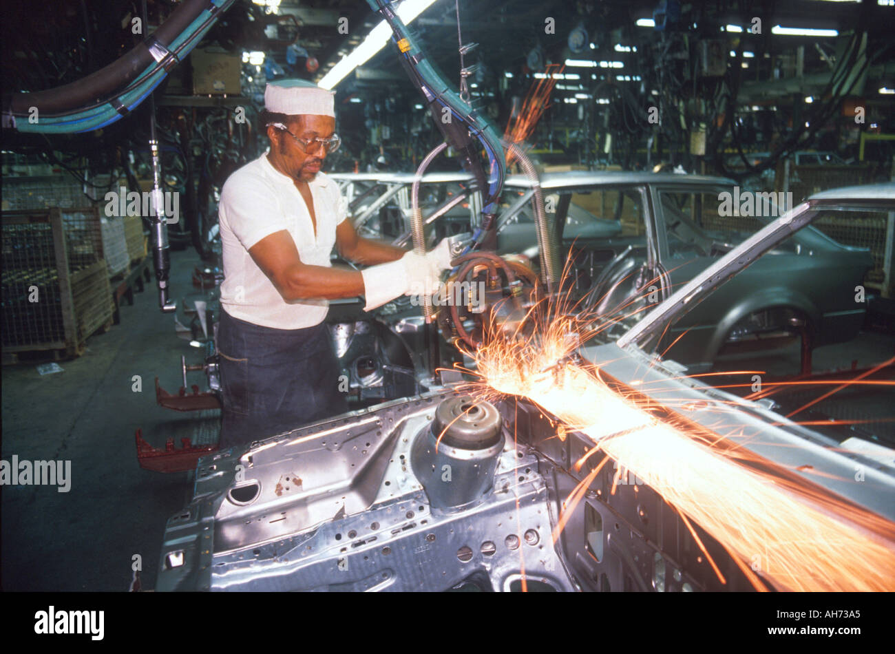 African American male works at Ford assembly line in Detroit Michigan welding auto body  Stock Photo
