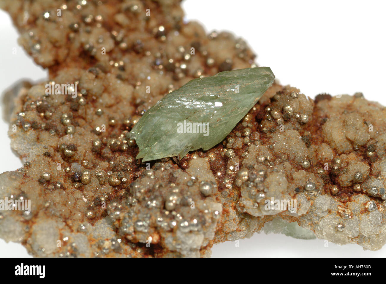 Mineral Ludlamite, Intergrown crystals on iron stained quartz matrix