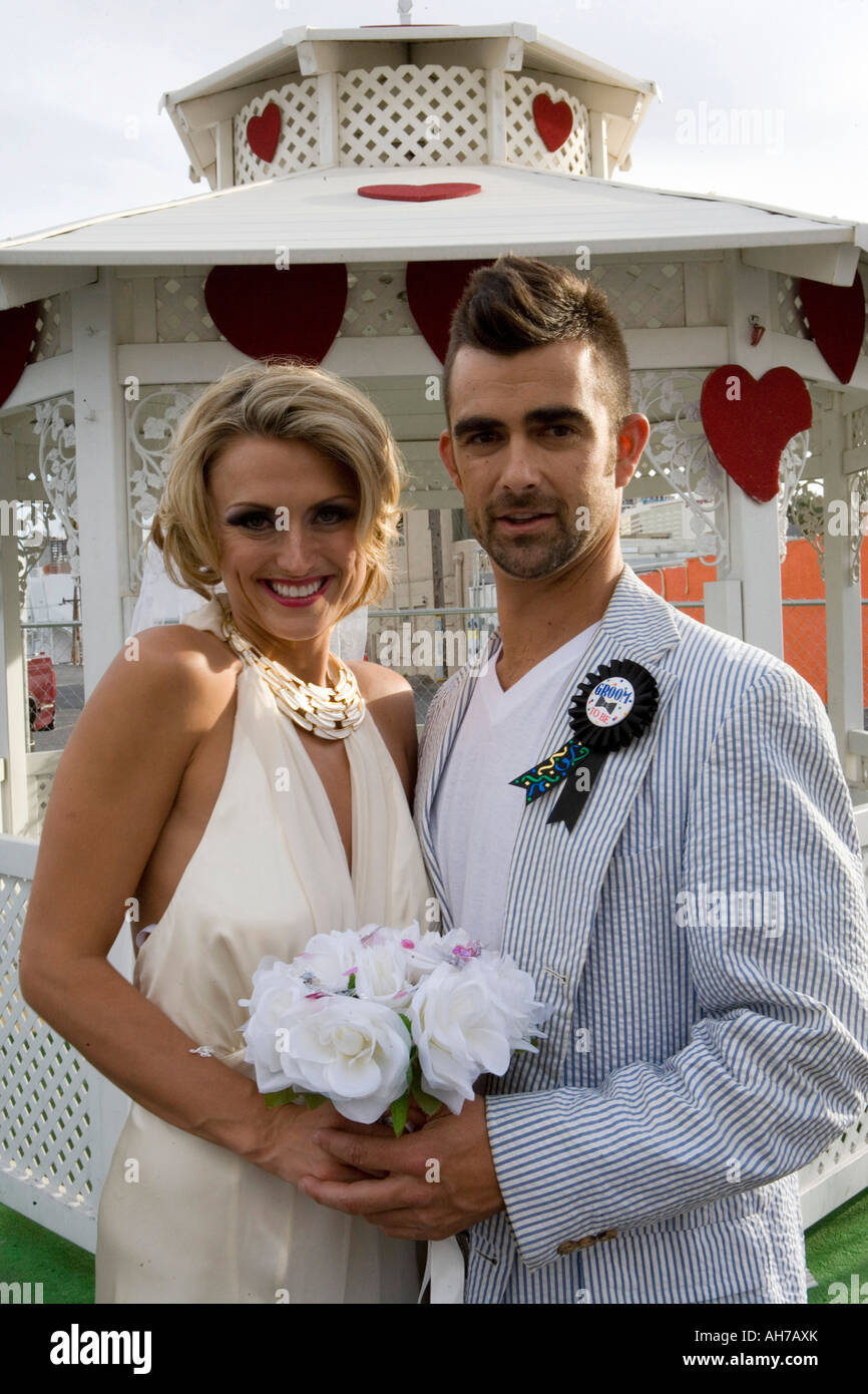 Bride and groom standing in front of a gazebo Stock Photo - Alamy