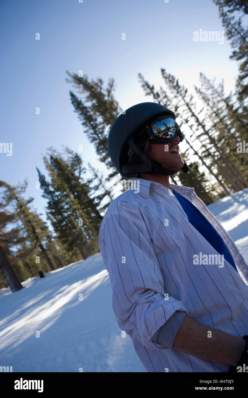 Young man wearing a helmet and ski goggles Stock Photo Alamy