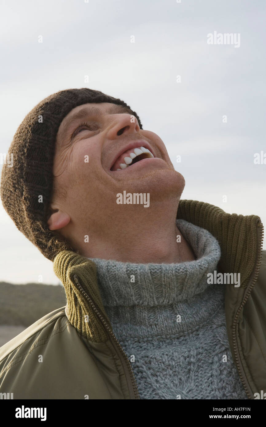 Close-up of a mid adult man laughing Stock Photo - Alamy