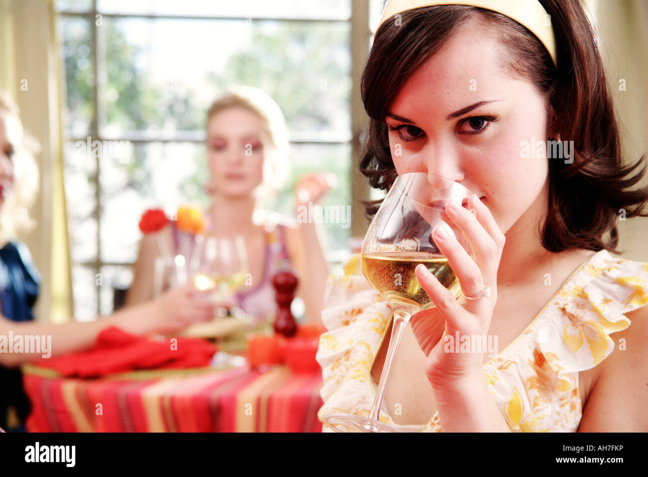 Portrait of a young woman drinking wine Stock Photo - Alamy