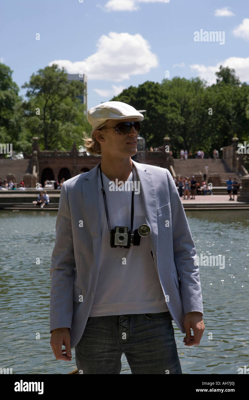 Young man standing by water, Central Park, Manhattan, New York City, New York, USA Stock Photo