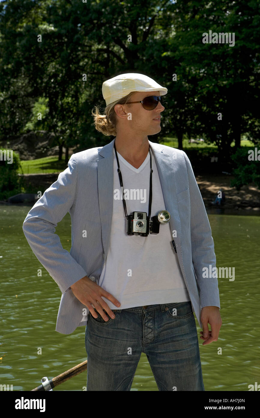 Young man standing by water, Central Park, Manhattan, New York City, New York, USA Stock Photo