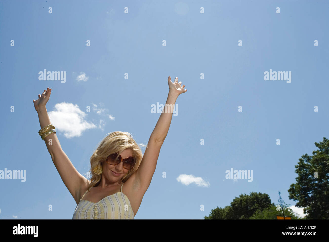 Raised arms woman hi-res stock photography and images - Alamy