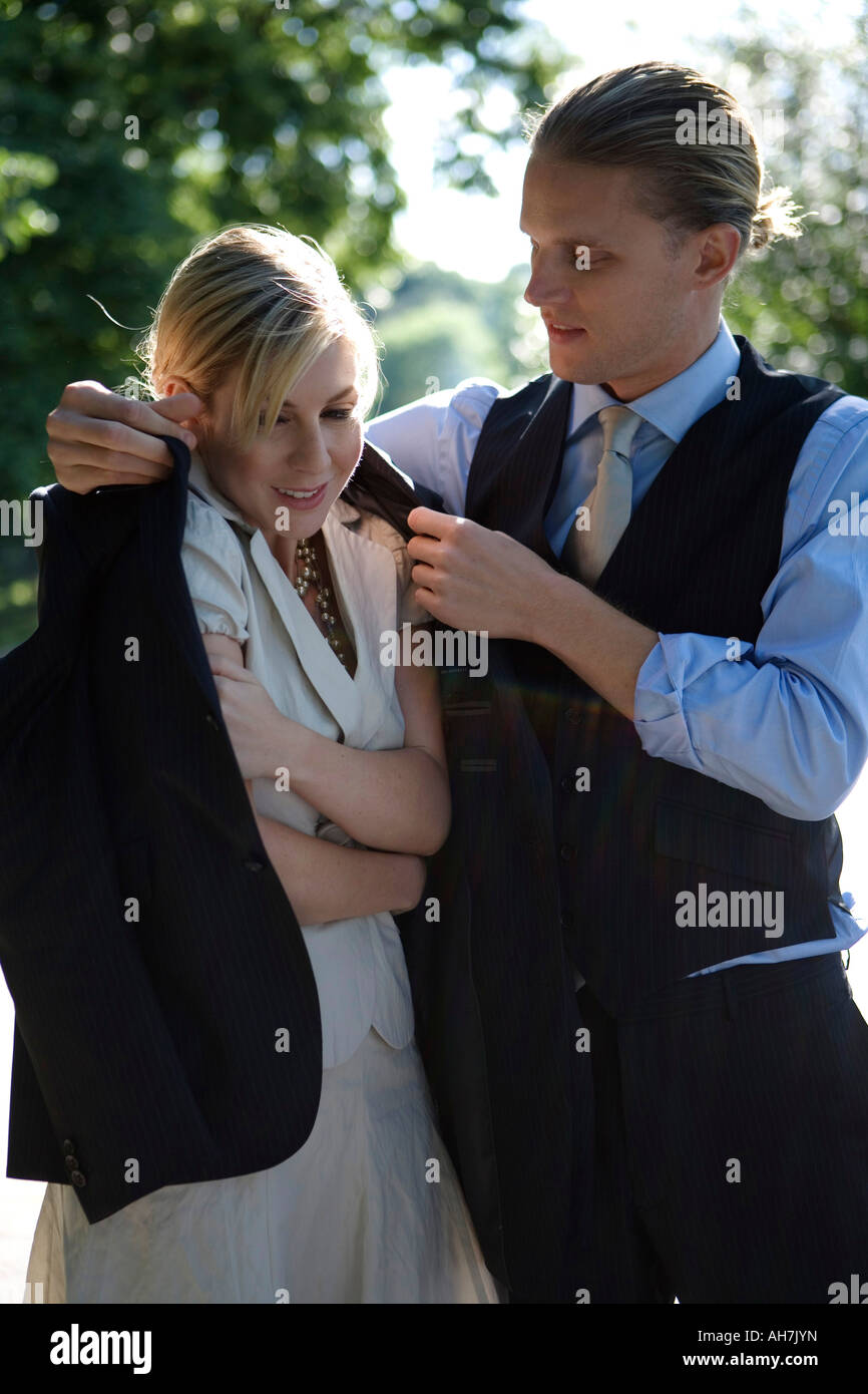 Putting on a coat hires stock photography and images Alamy