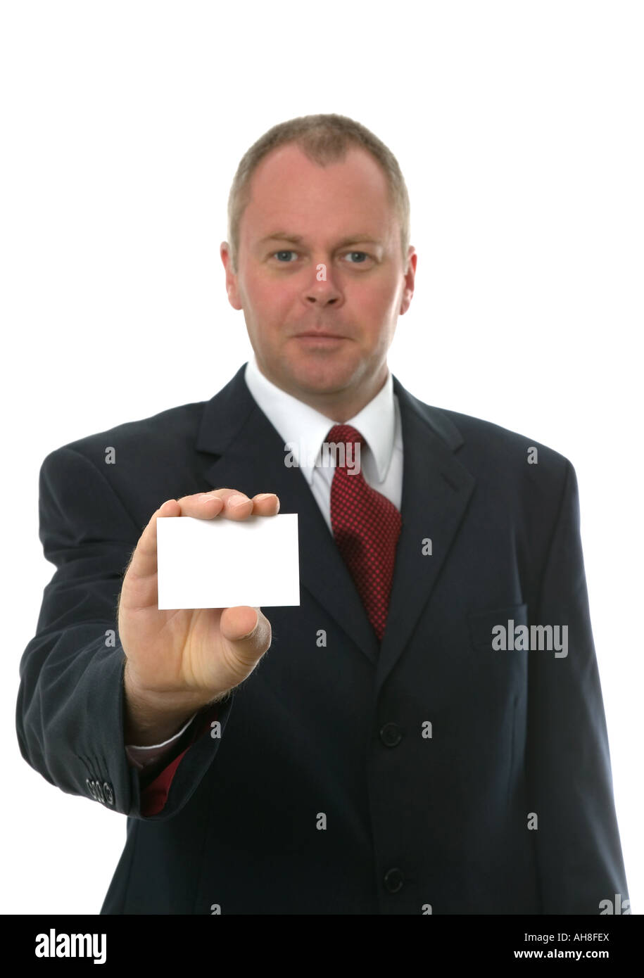 Businessman presenting his card to you Focus on blank card Isolated on white Stock Photo