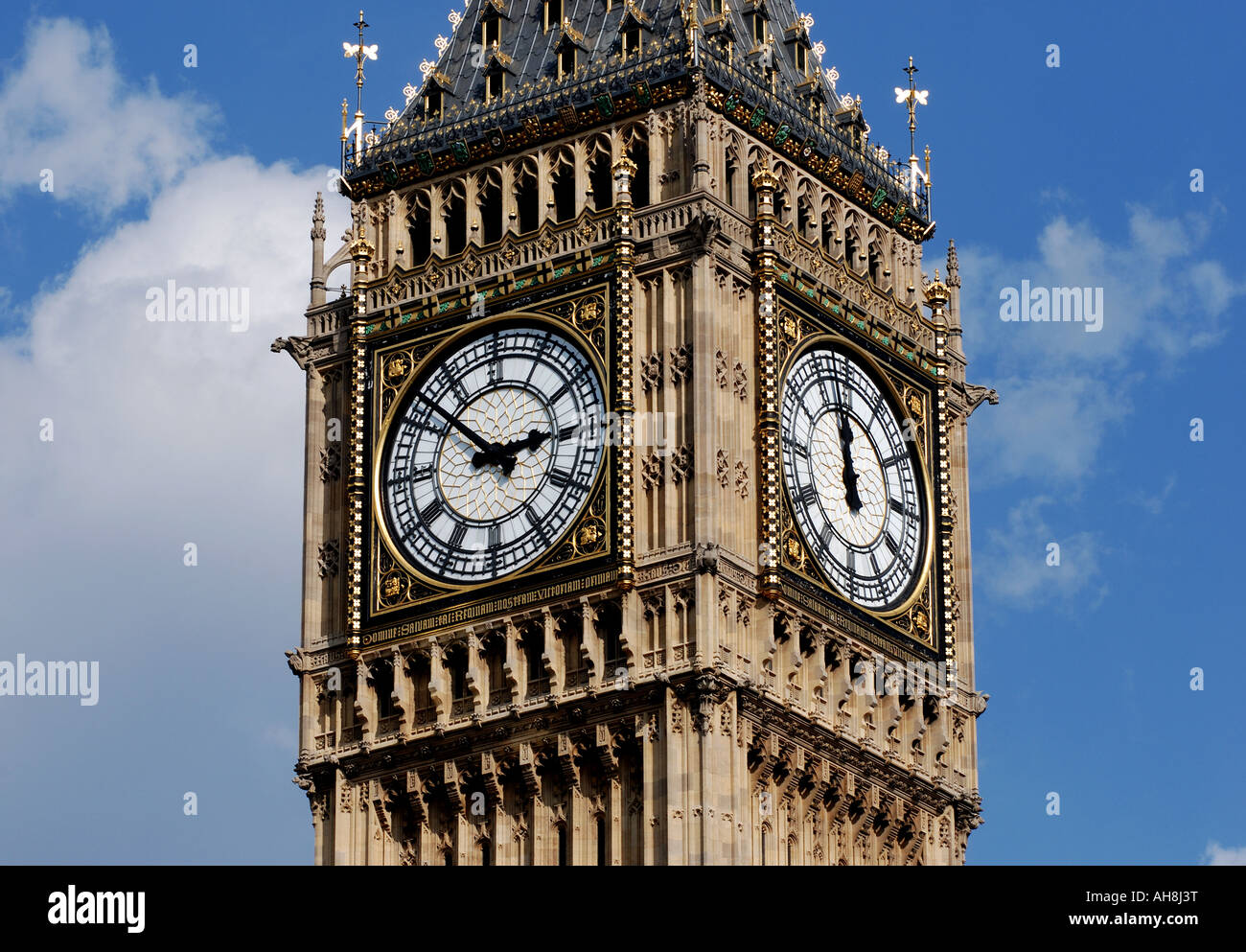 Big Ben with clocks showing different times, London, England, UK Stock