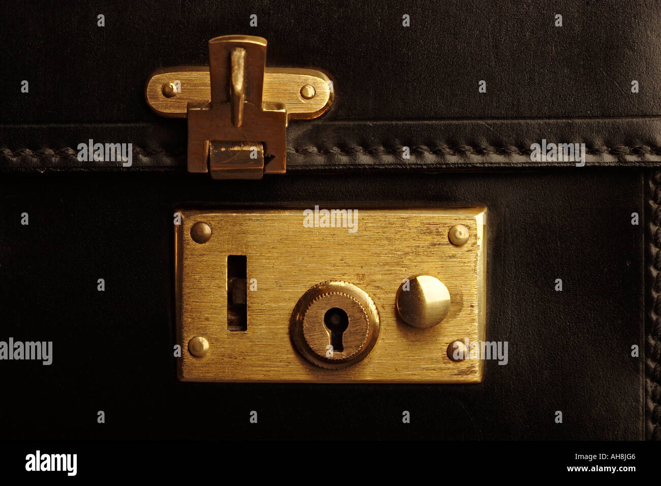 Briefcase with open lock detail Stock Photo Alamy