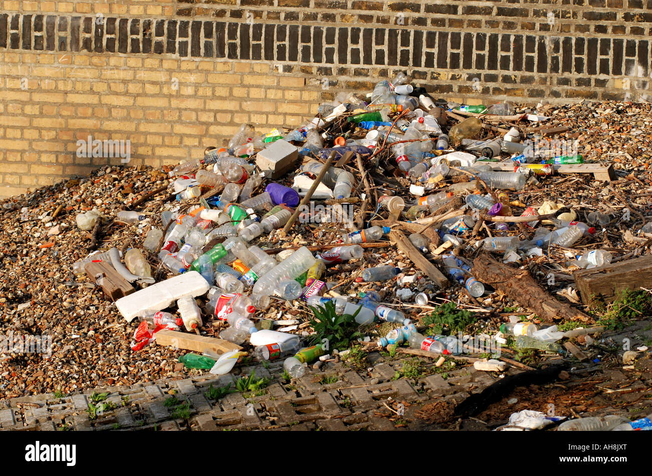 Litter washed up on River Thames shore near Vauxhall Bridge, London