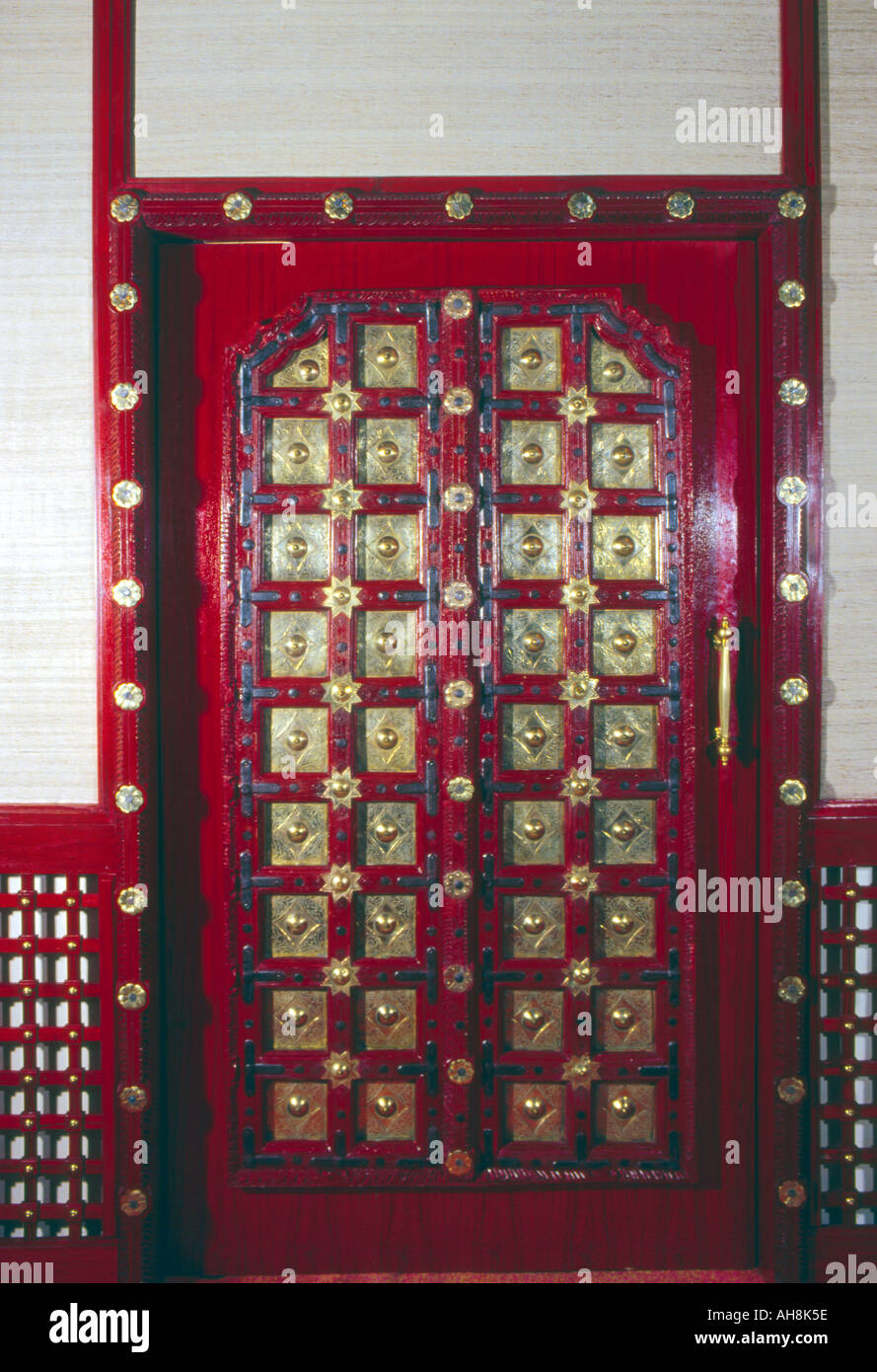 AAD71474 Wooden door Brass fittings Stock Photo