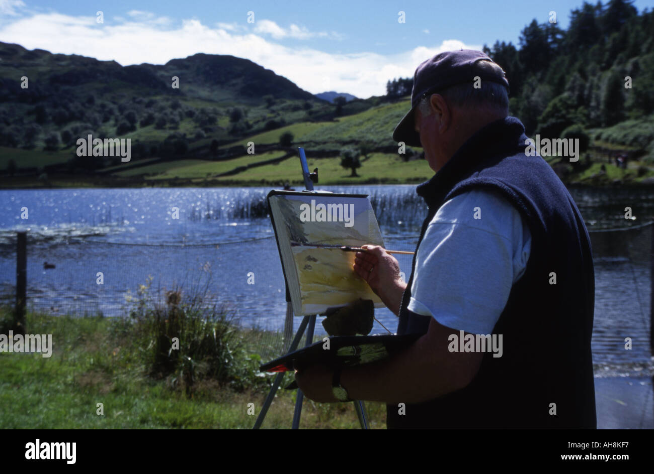 Man painting watercolor of lake at Watendlath, Lake District Stock Photo