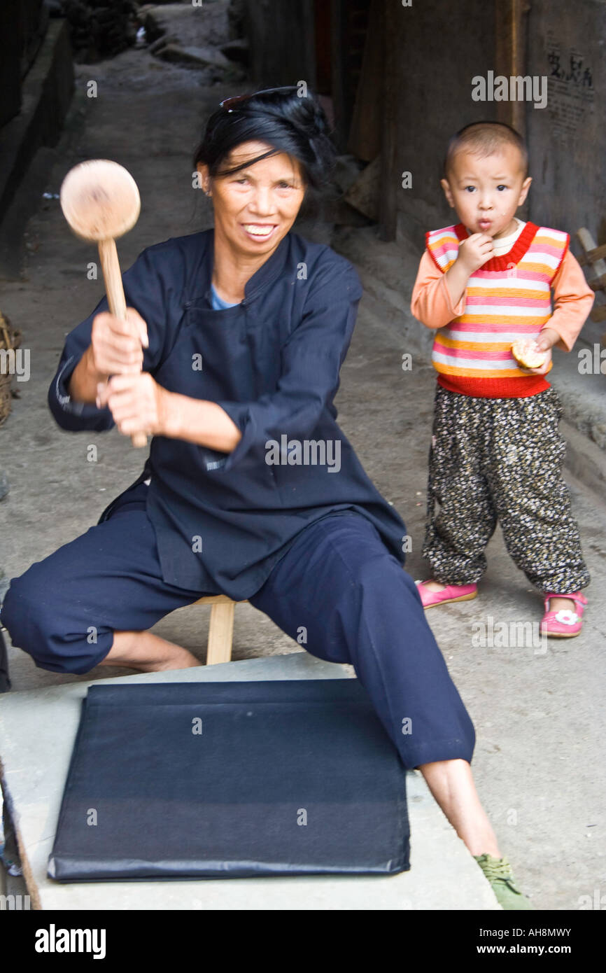 Dong Ethnic Minority Woman Pounding Colour into Indigo Cloth Zhaoxing China Stock Photo