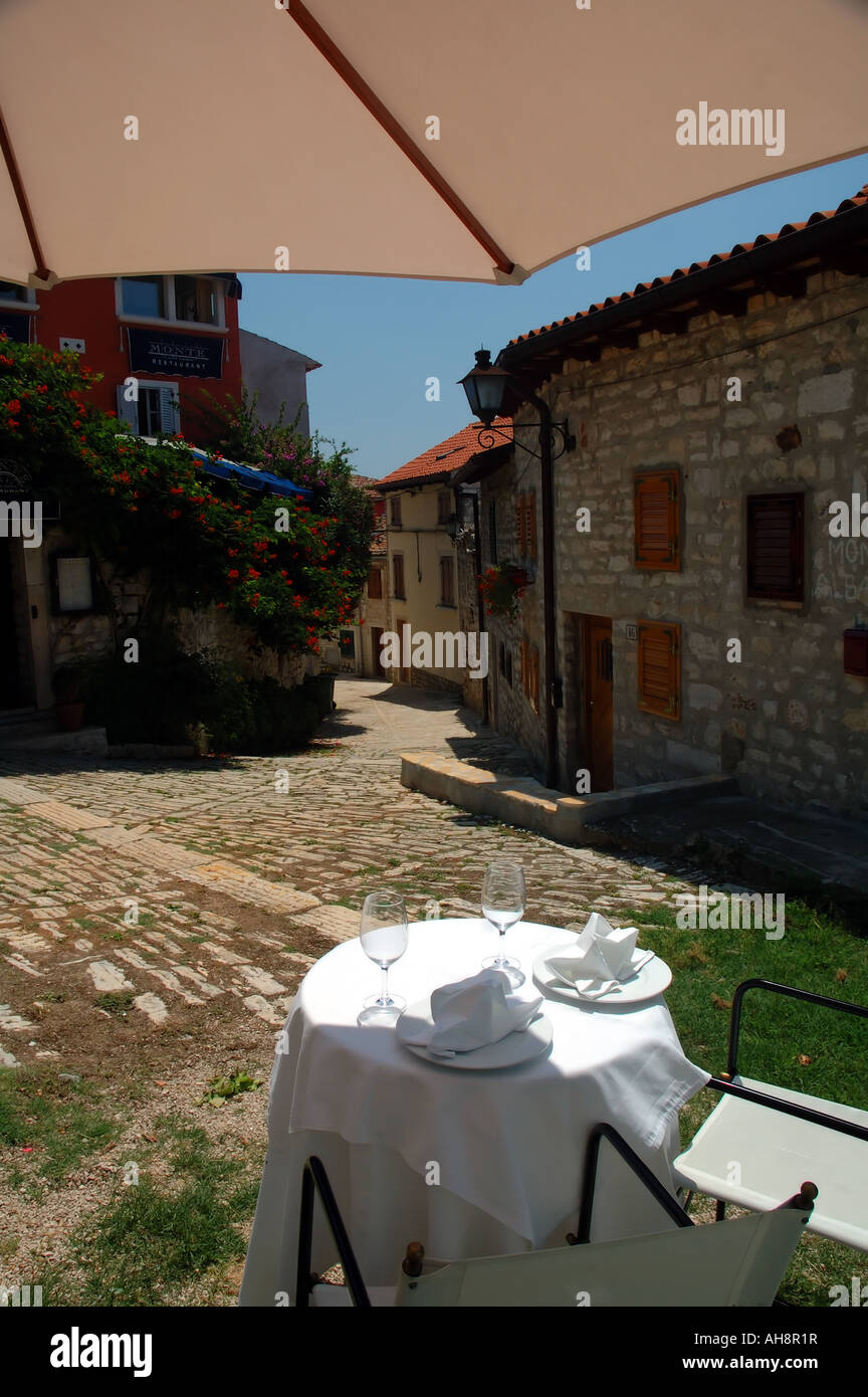 Al fresco dining for two outside the Restaurant Monte in the old town of Rovinj Istria Croatia Stock Photo