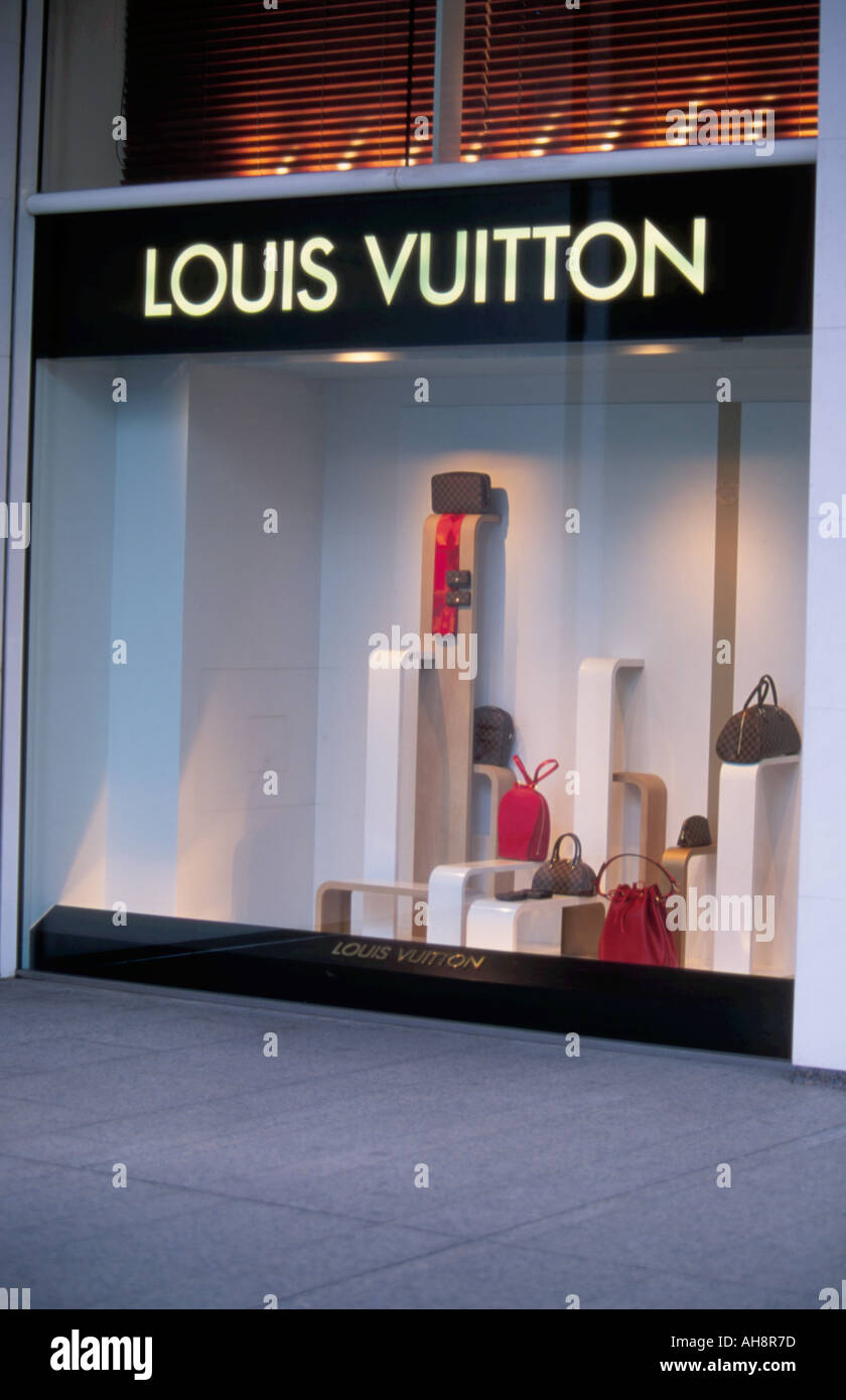 LV,  in a shop window at the Louis Vuitton store in the …