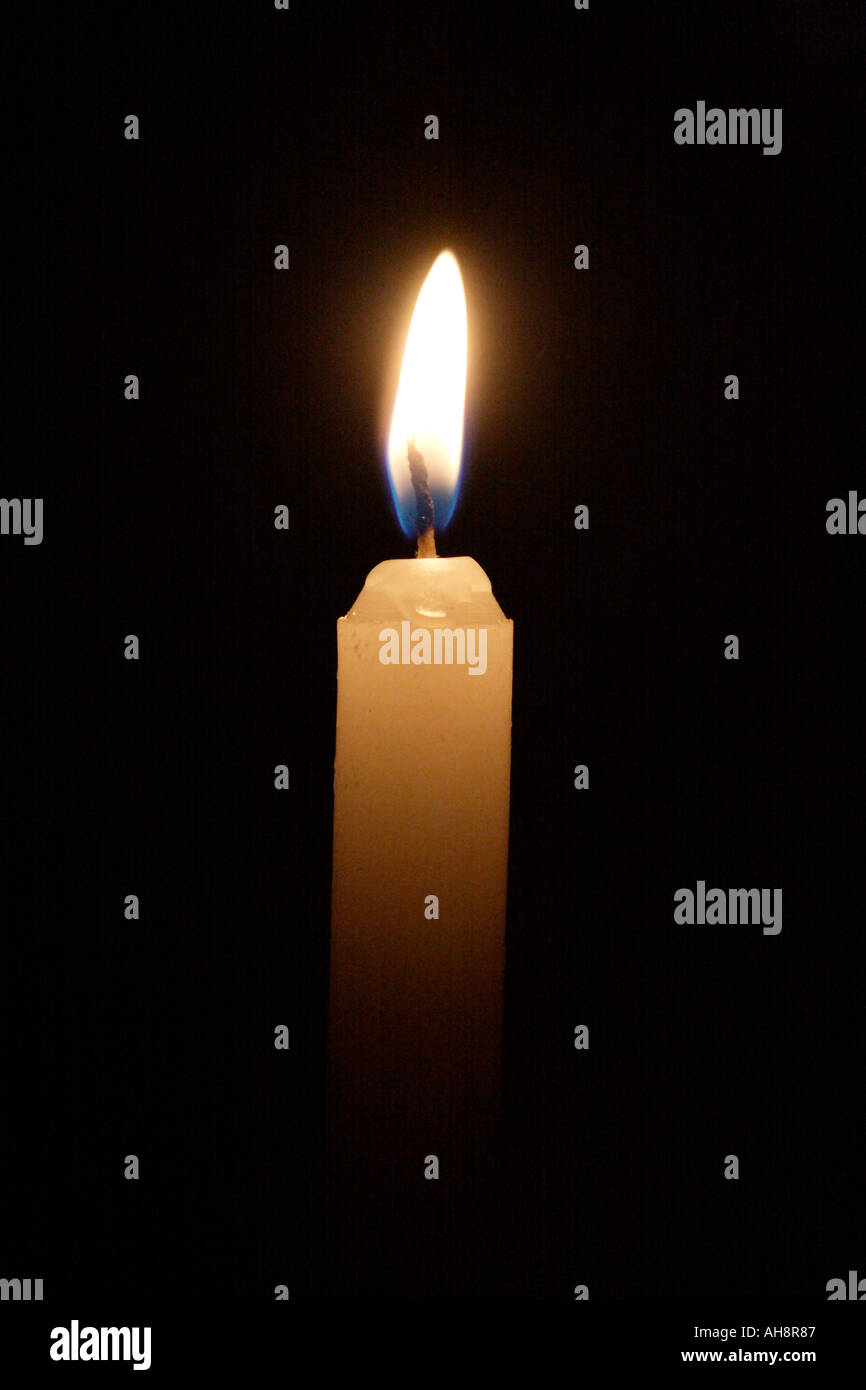 Candle burning in the dark Stock Photo Alamy
