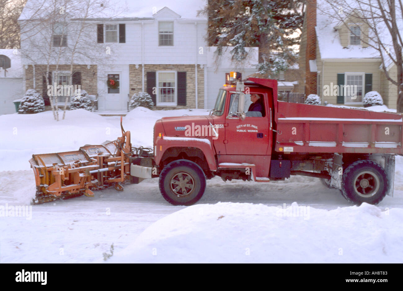 City plow truck clearing away snow after heavy fall. St Paul Minnesota