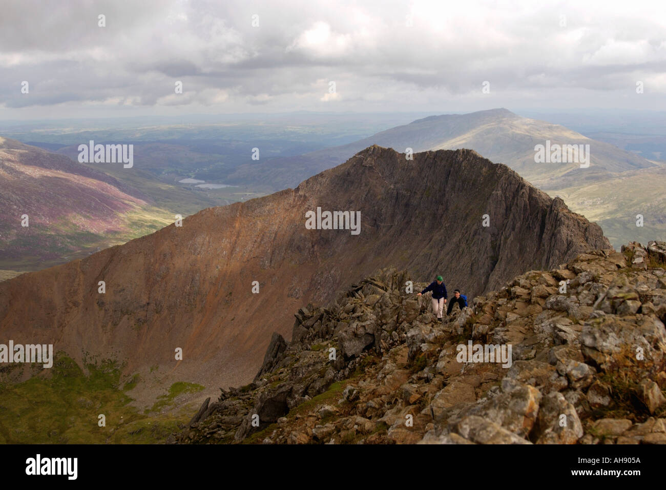 Walkers On The Crib Goch Ridge On Route To The Summit Of Snowdon