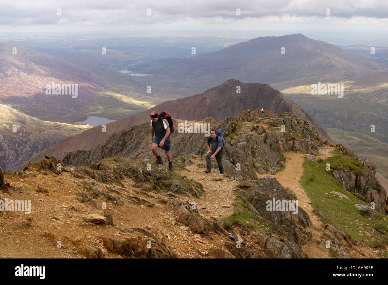 Walkers On The Crib Goch Ridge On Route To The Summit Of Snowdon