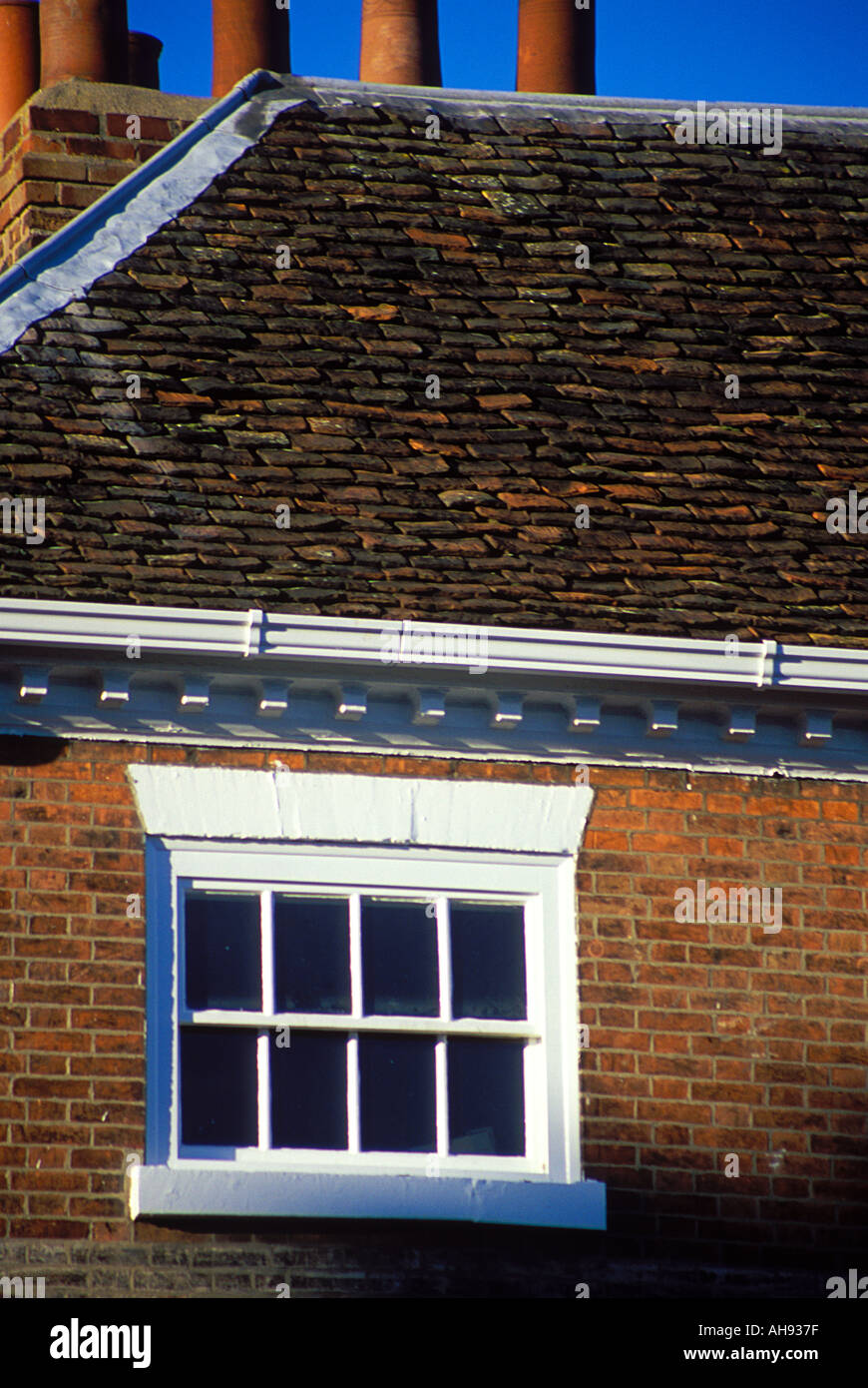 Ancient roofscape of plain tiles and window Beverley East