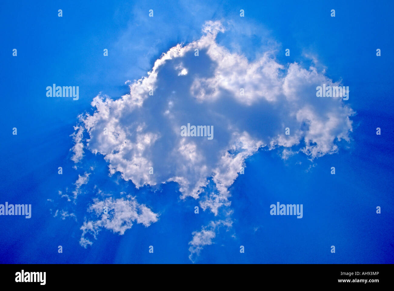 WHITE CLOUD AGAINST BLUE SKY. Stock Photo