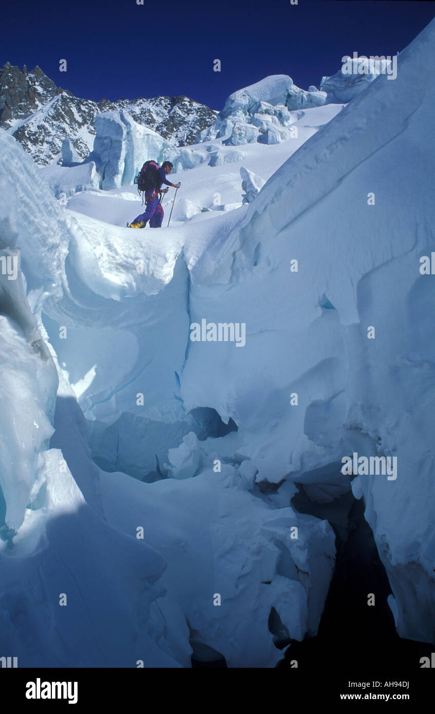 Traversing a glacier crevasse on skies Mont Blanc Alps Stock Photo