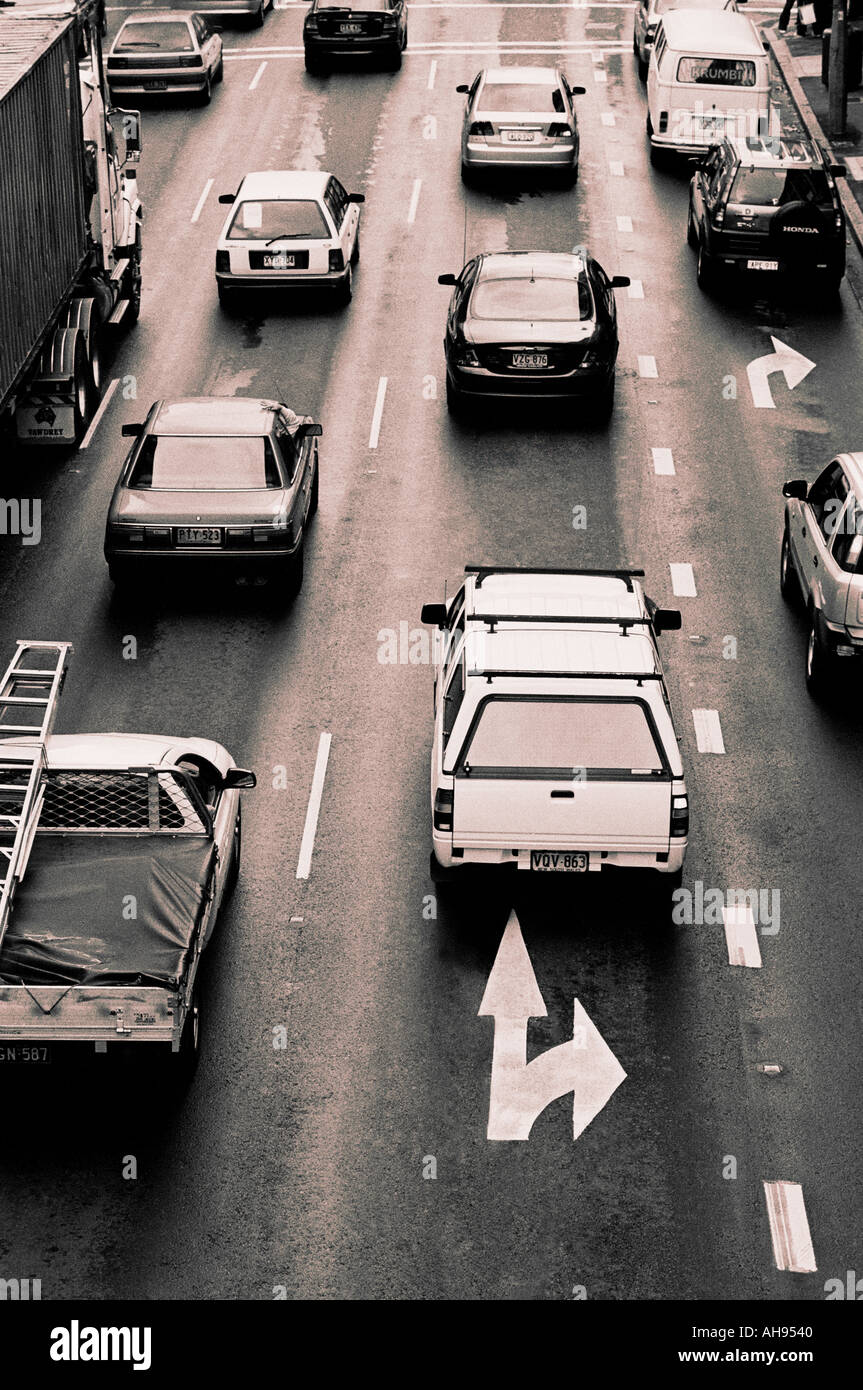 Lanes of traffic coming to a stop at a traffic light Stock Photo Alamy
