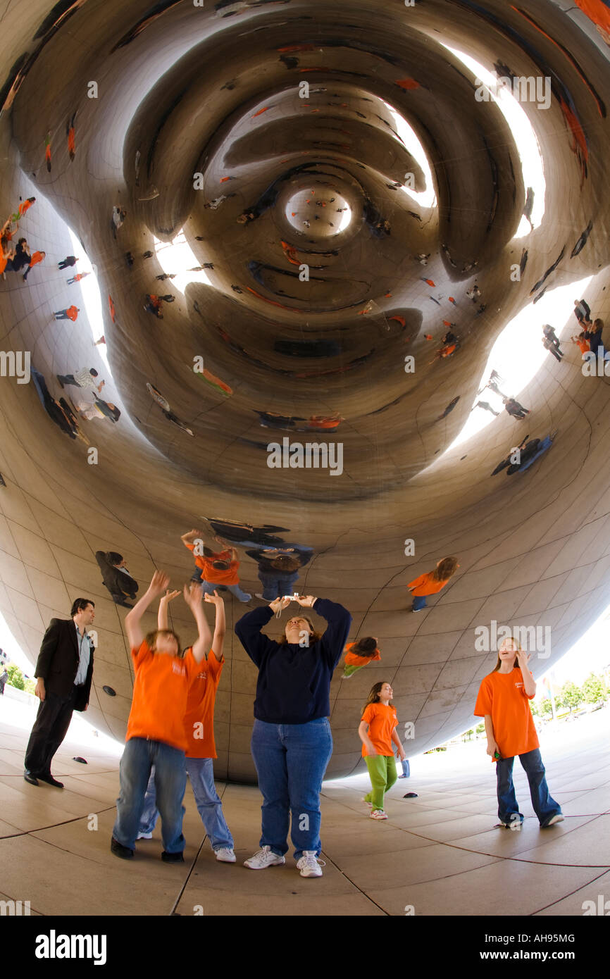 ILLINOIS Chicago Visitors photograph themselves distorted in reflection