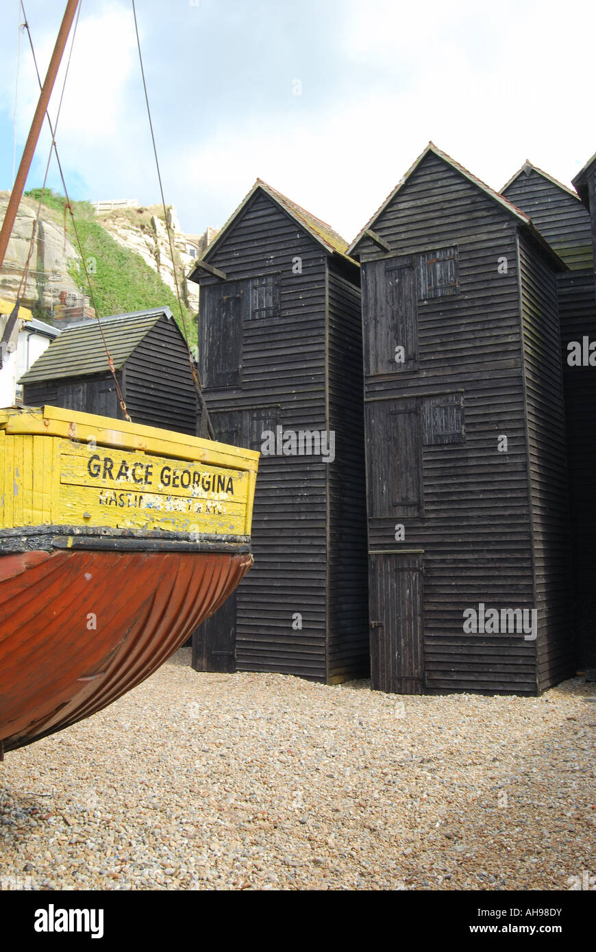 Fishing boats and net drying sheds, The Stade, Hastings Old Town, Hastings, East Sussex, England, United Kingdom Stock Photo