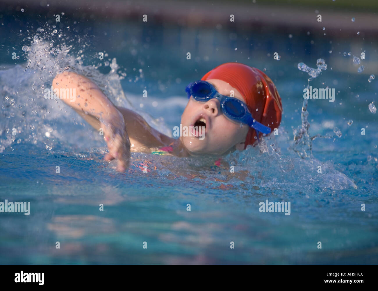 Child swimming freestyle in a swimming pool Stock Photo Alamy