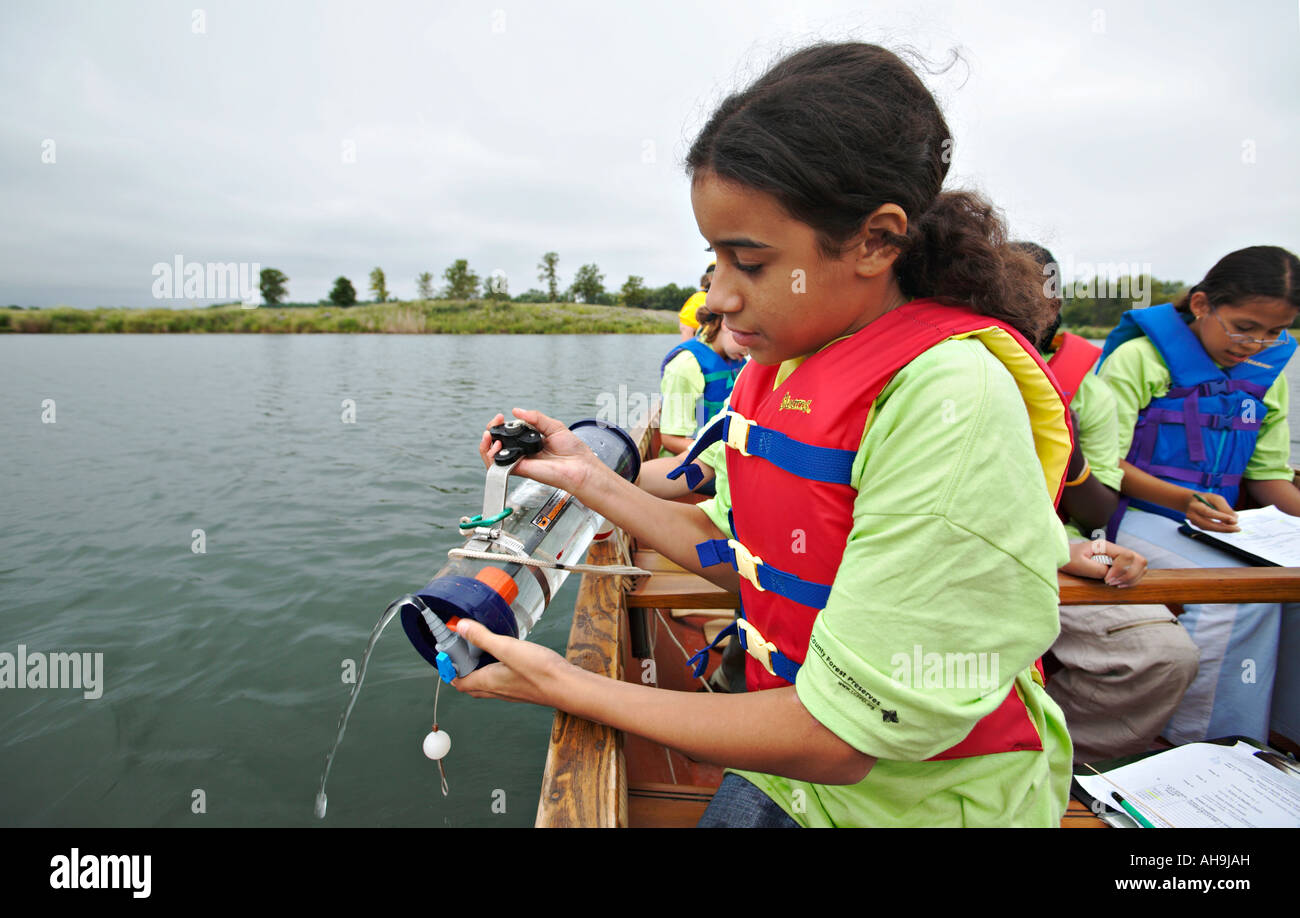 PRESERVES Libertyville Illinois Girl use tube to measure students conduct water quality tests in lake ScienceFirst summer camp Stock Photo