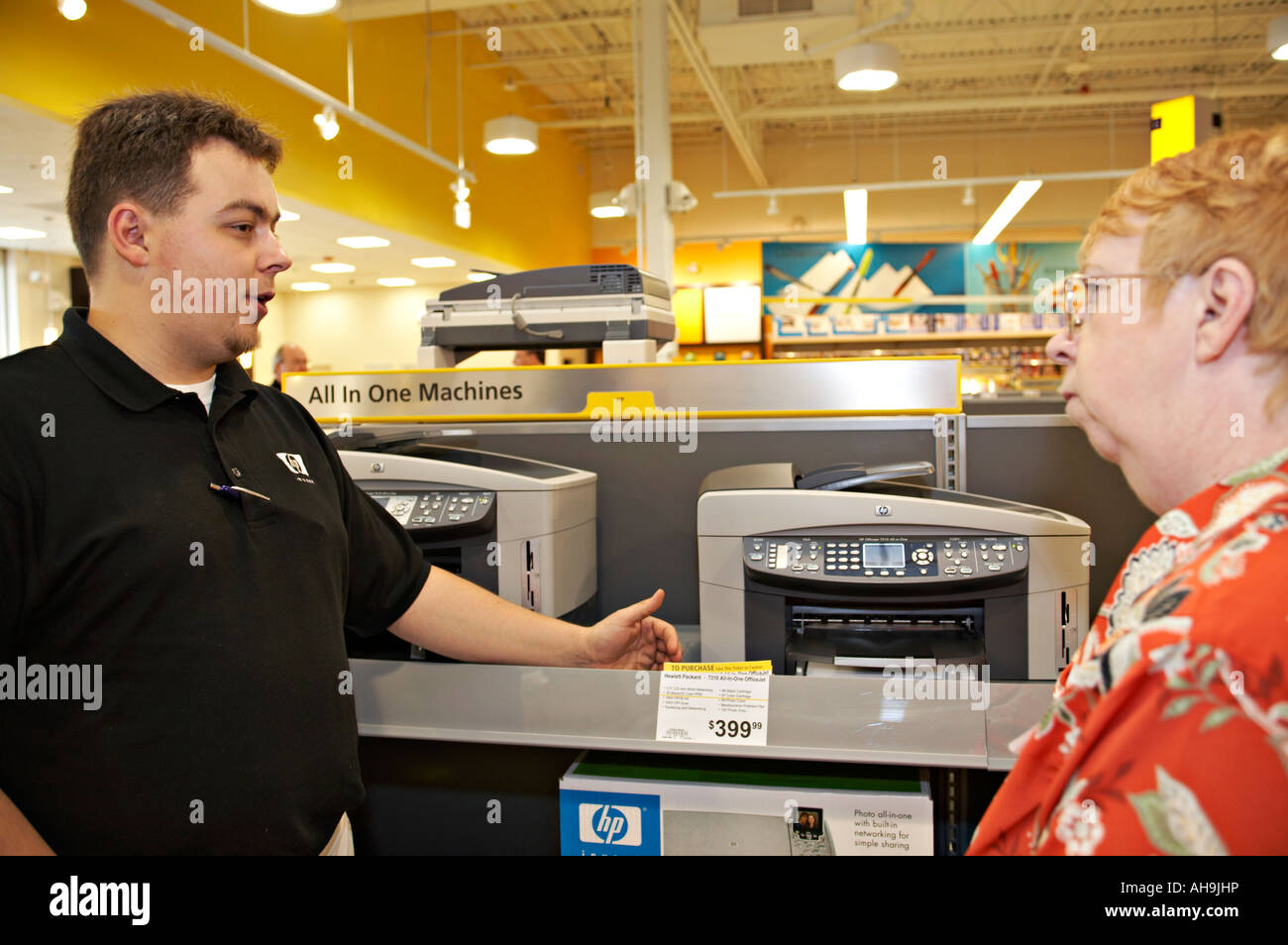 EVENT Hoffman Estates Illinois Salesman discuss computer printer with adult  woman customer in OfficeMax store Stock Photo - Alamy