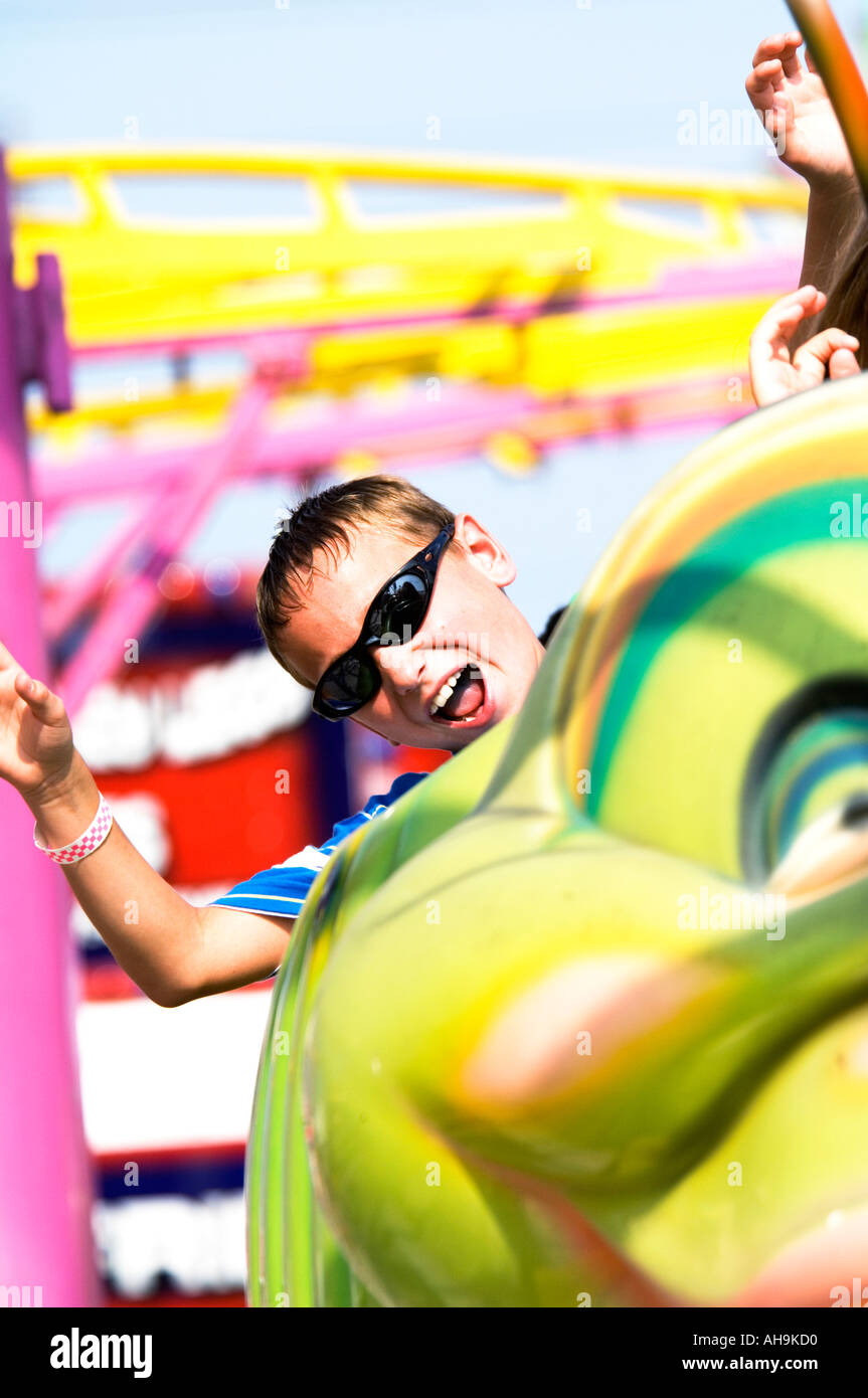 Boy on carnival ride Stock Photo - Alamy