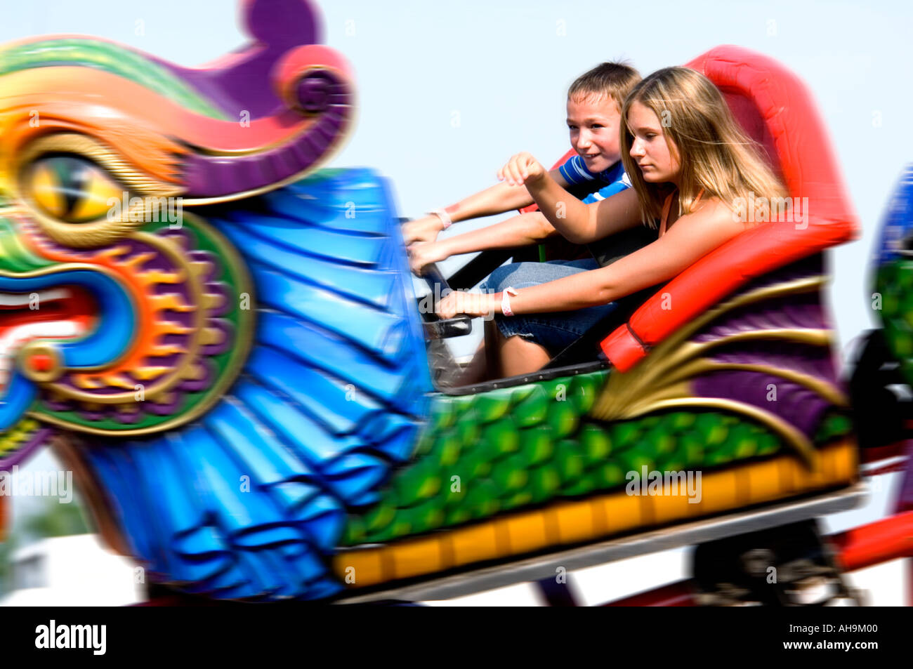 Kids on a carnival ride Stock Photo Alamy