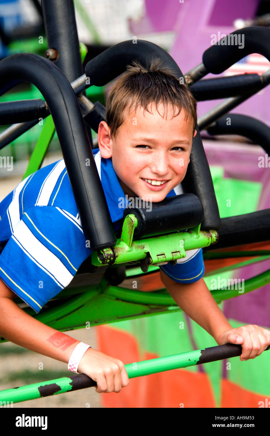 Kid on a carnival ride Stock Photo - Alamy