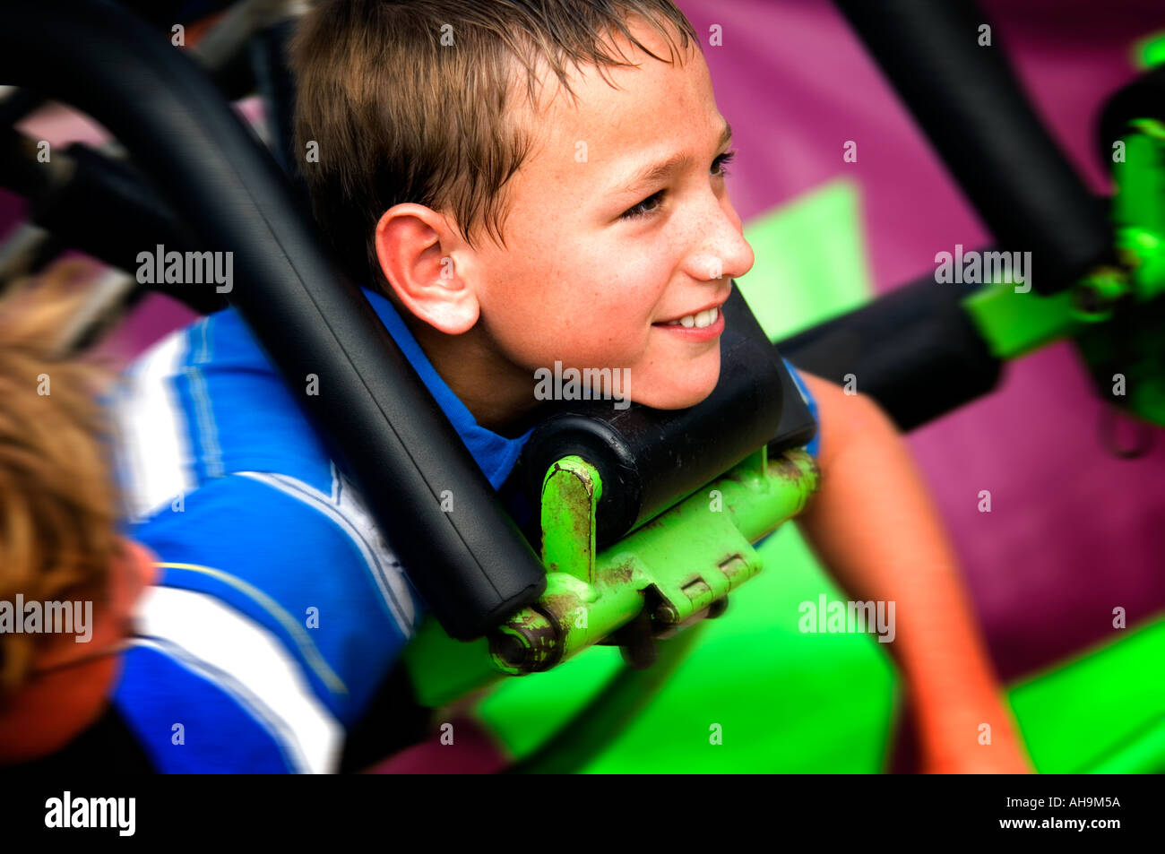 Kid on a carnival ride Stock Photo - Alamy