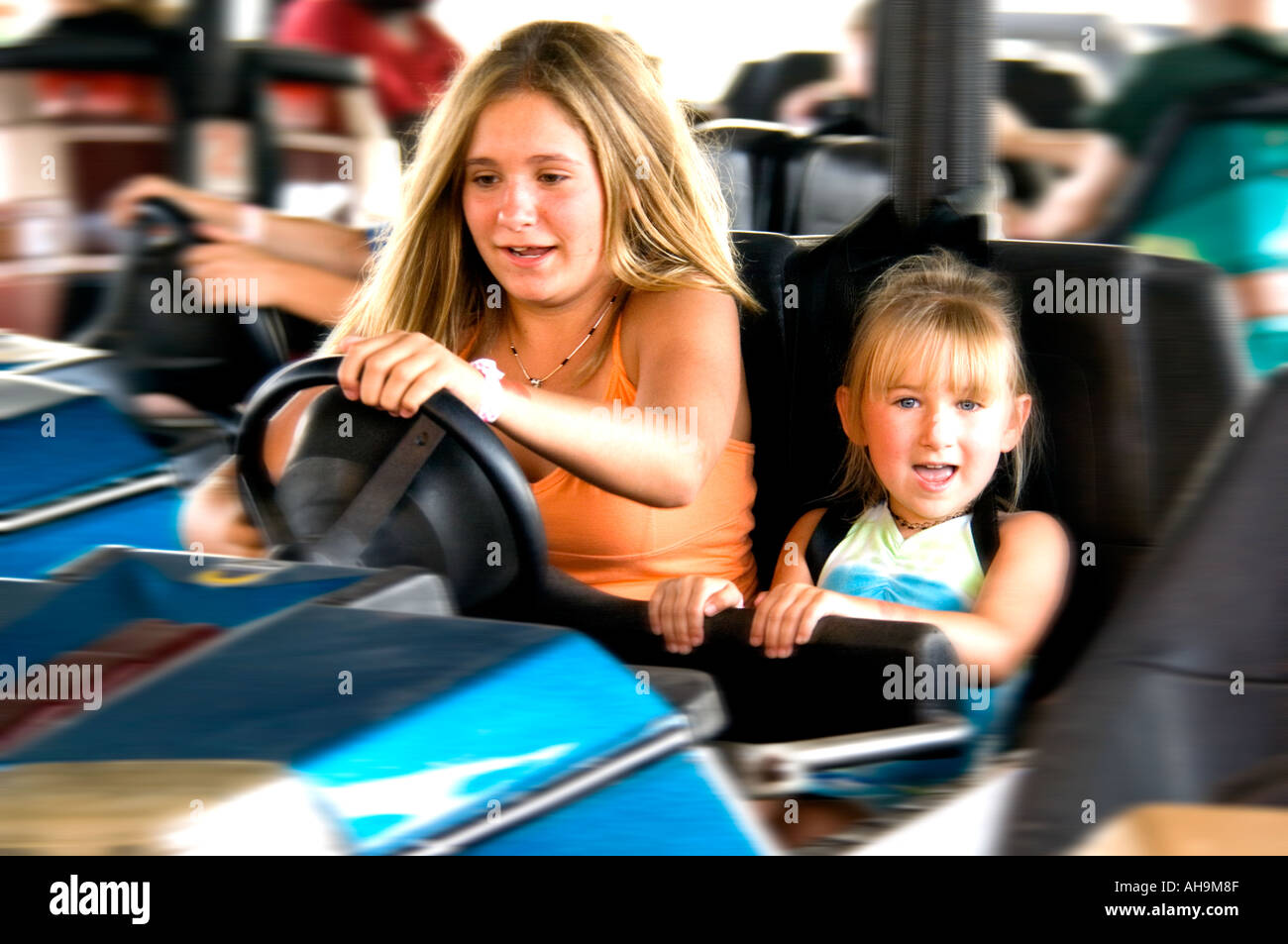 Kids on carnival ride Stock Photo - Alamy