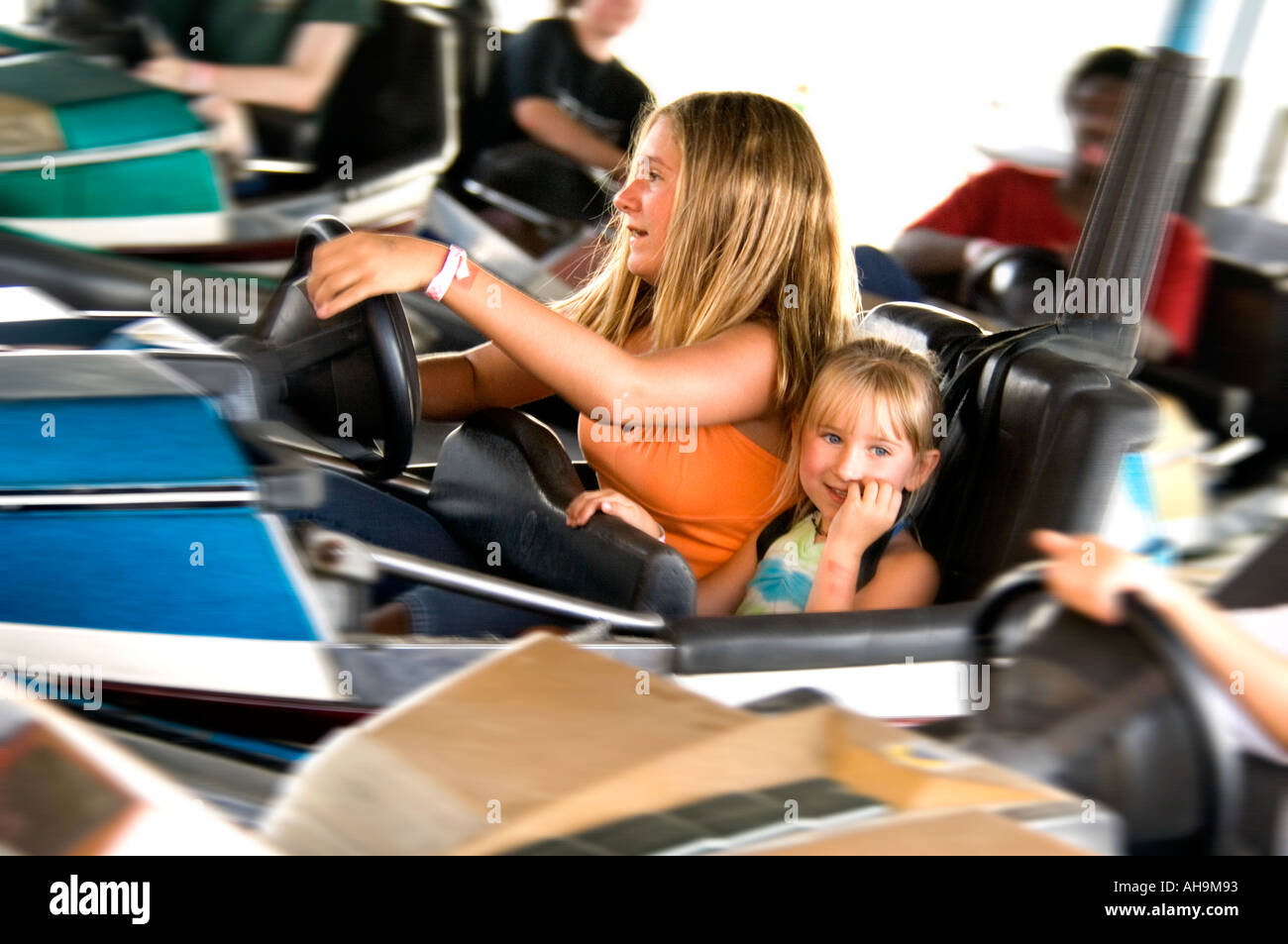 Kids on carnival ride Stock Photo - Alamy