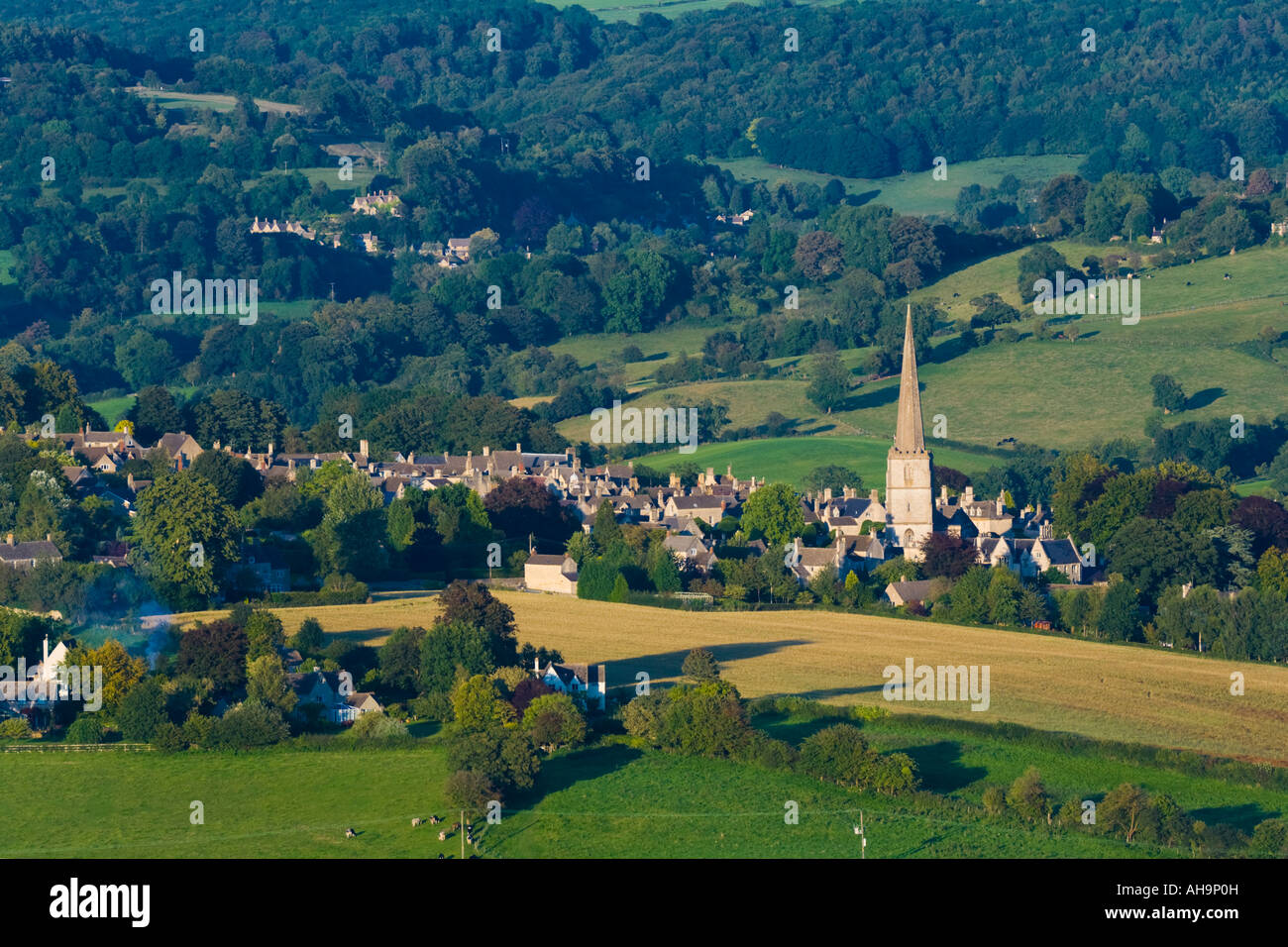 An evening view of the Cotswold village of Painswick viewed from Edge