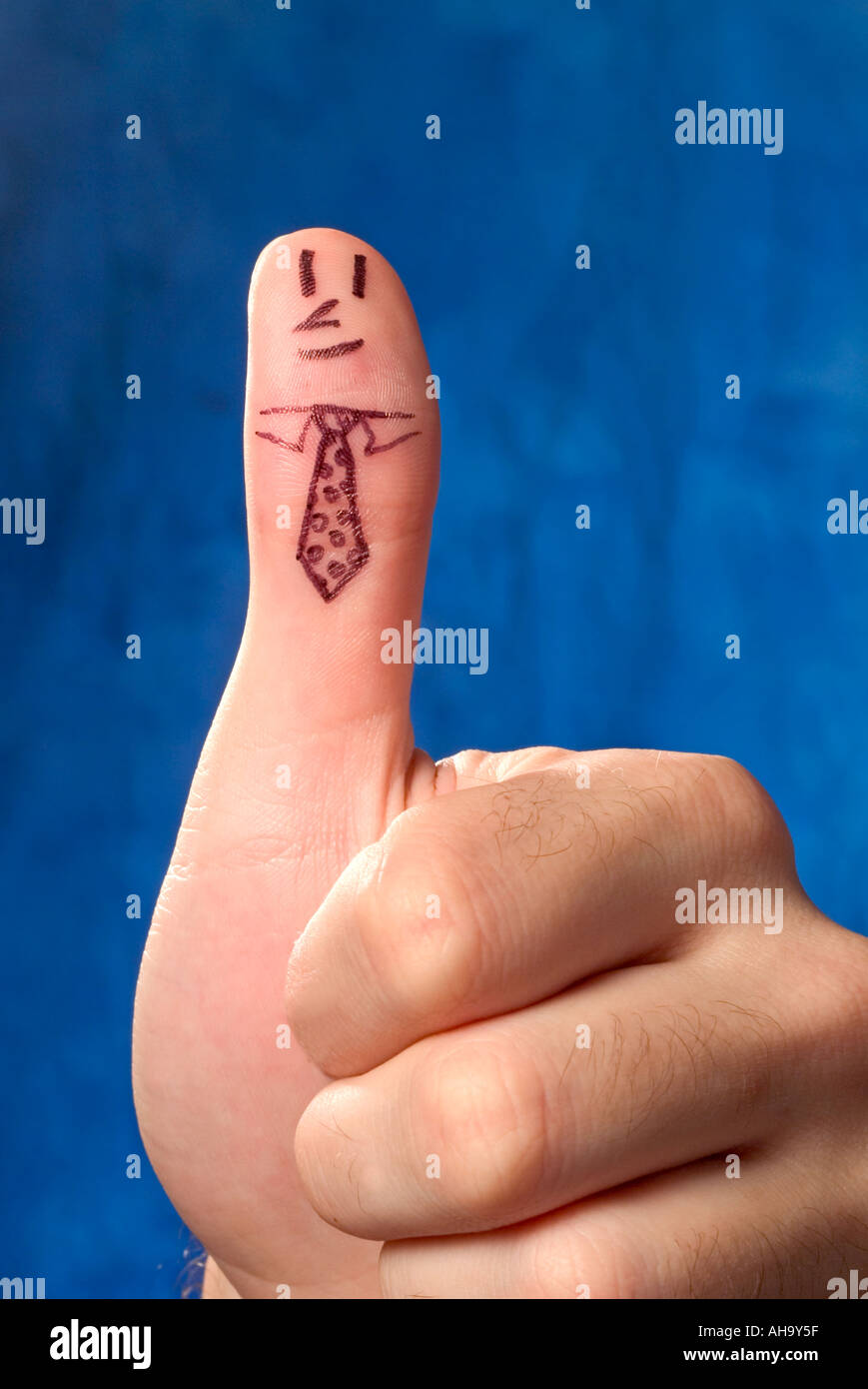 thumb with face Stock Photo - Alamy