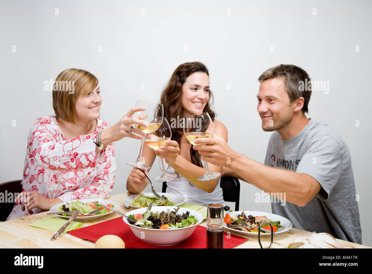 young people drinking a toast Stock Photo