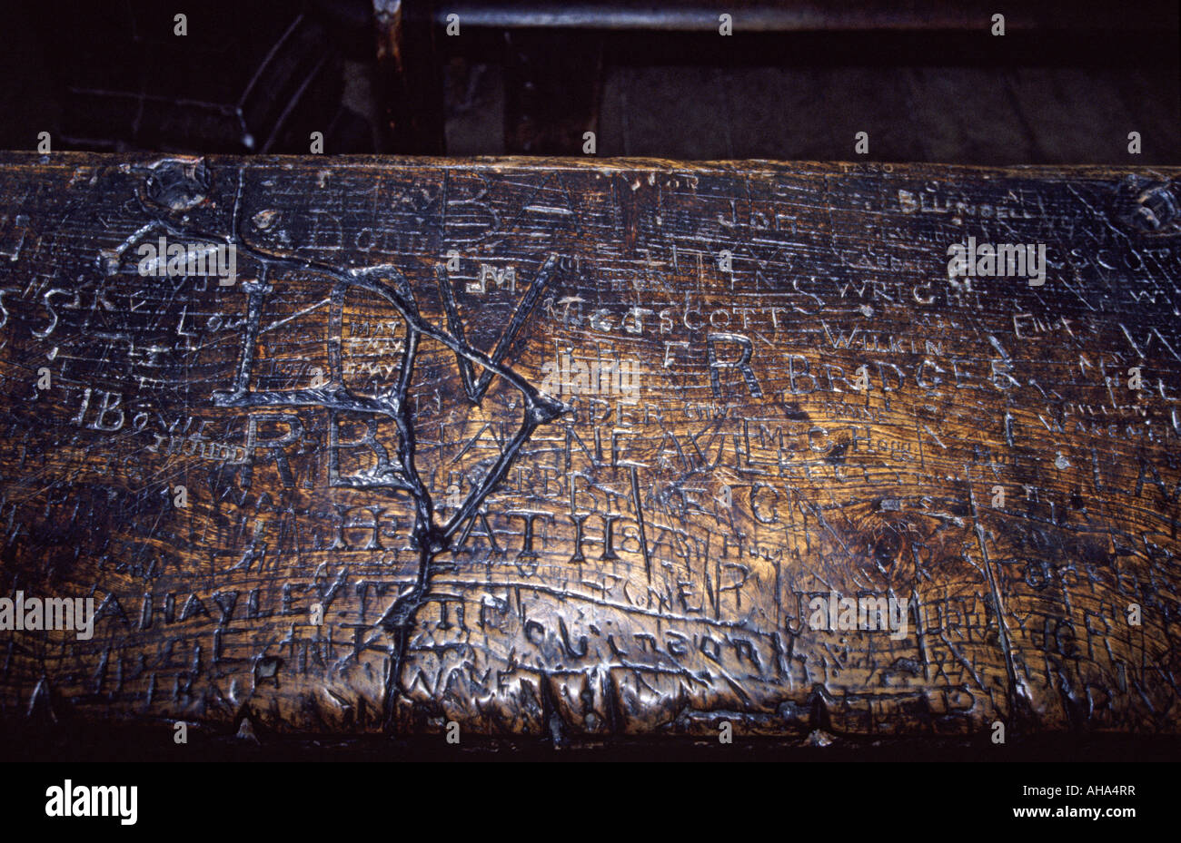 One of the famous desks at Eton College where students have carved their names for centuries, Eton, near Windsor, England UK Stock Photo