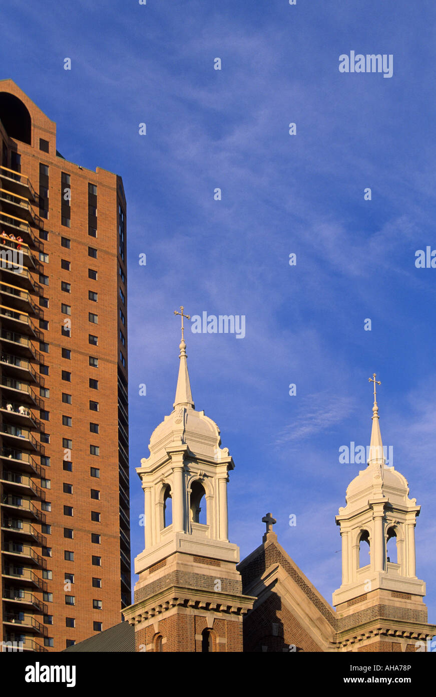 HIGHRISE APARTMENT BUILDING AND TWIN STEEPLES OF ST. LOUIS CATHOLIC
