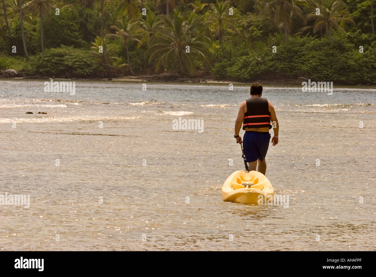 Lone man with a Kayak at Isla Grande, Colon, Panama, Central America Stock Photo