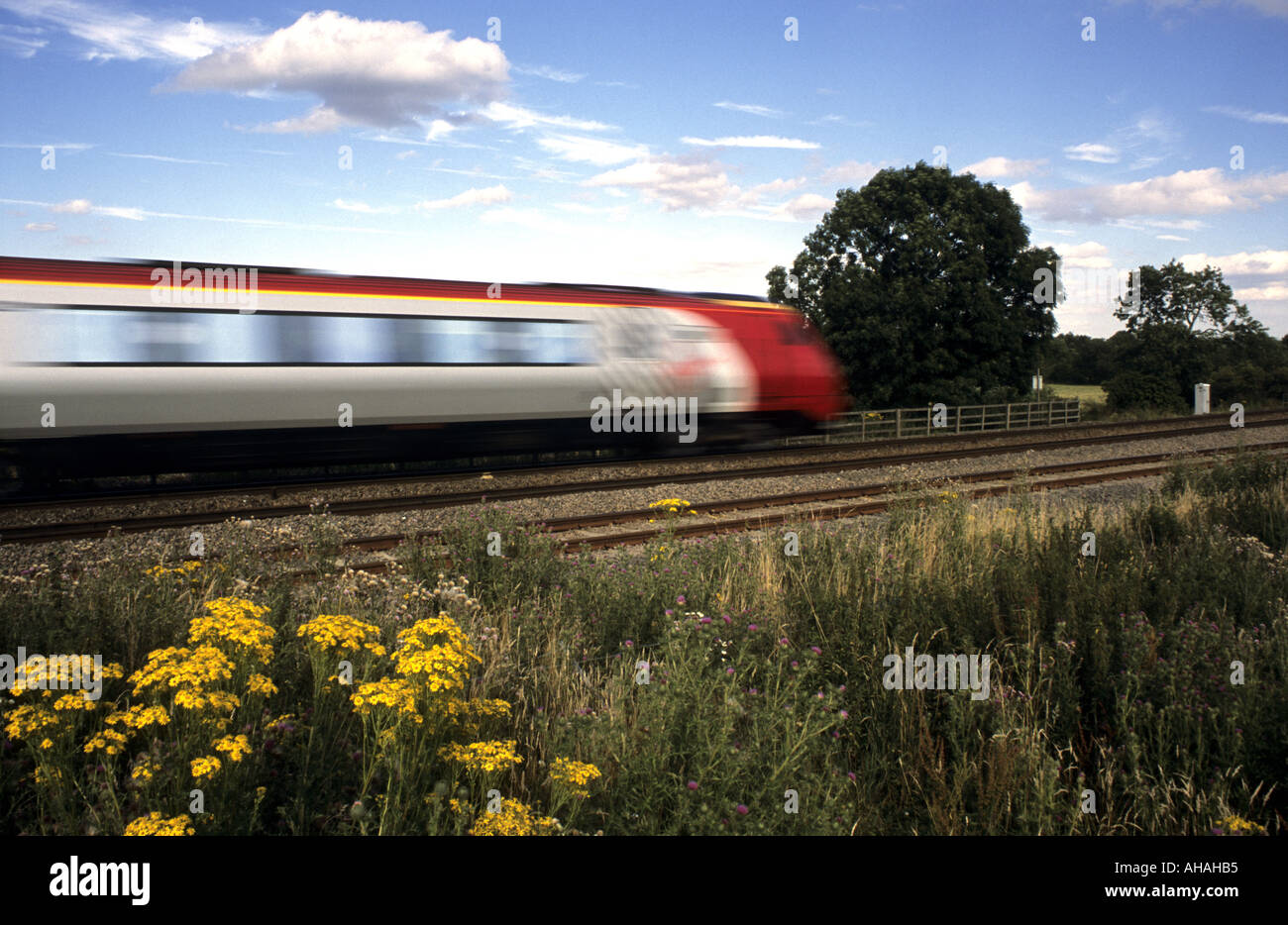 Virgin Trains Voyager diesel train at speed, Warwickshire, England, UK Stock Photo