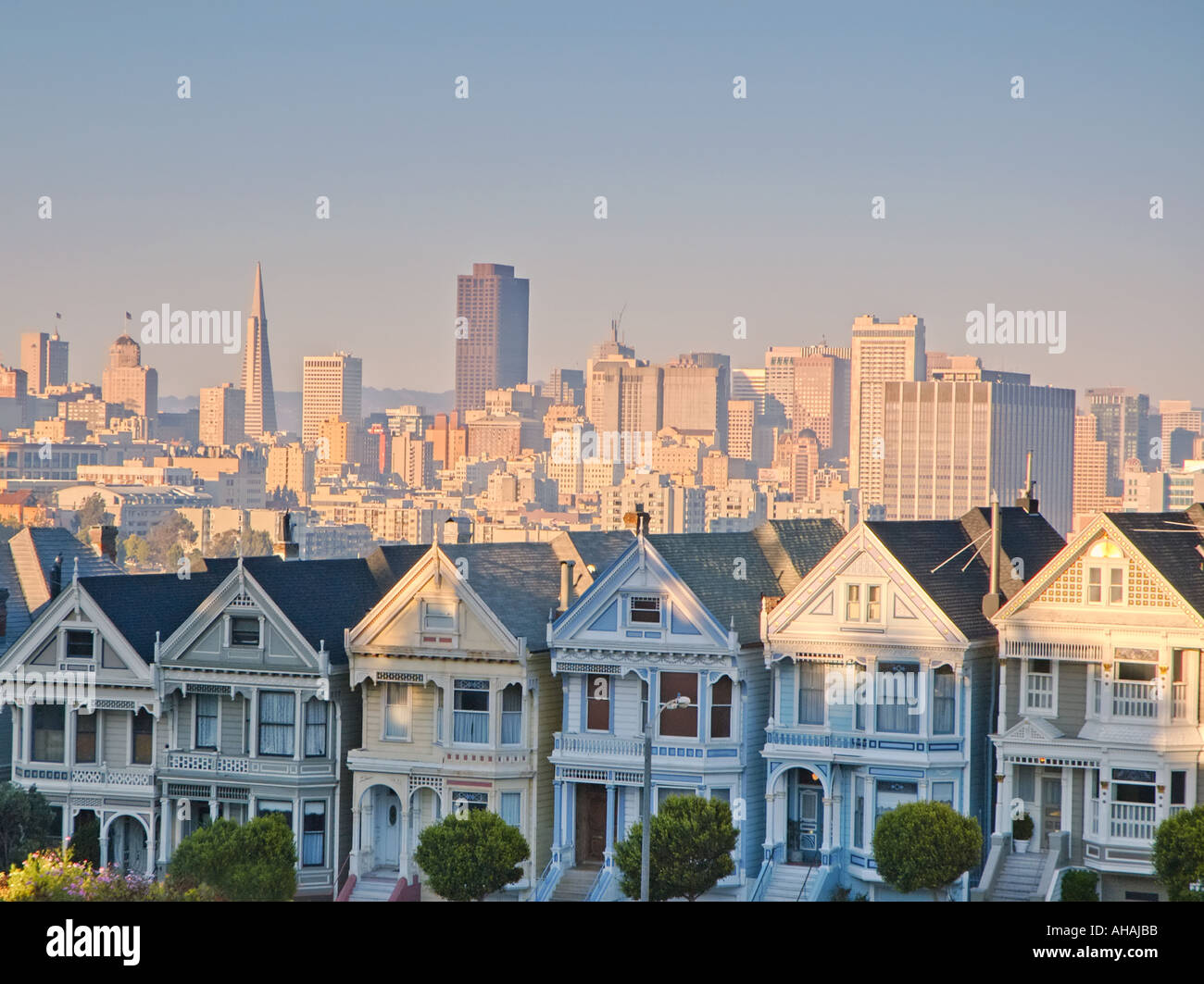 Alamo Square the famous San Francisco landmark with a view of the city in the background Stock Photo