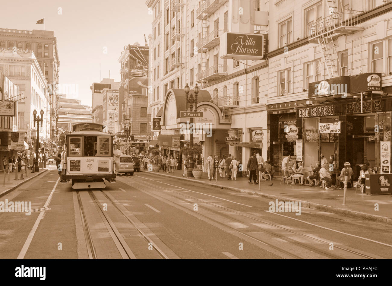 A cable car makes it s way through San Francisco in this old fashioned sepia toned image Stock Photo
